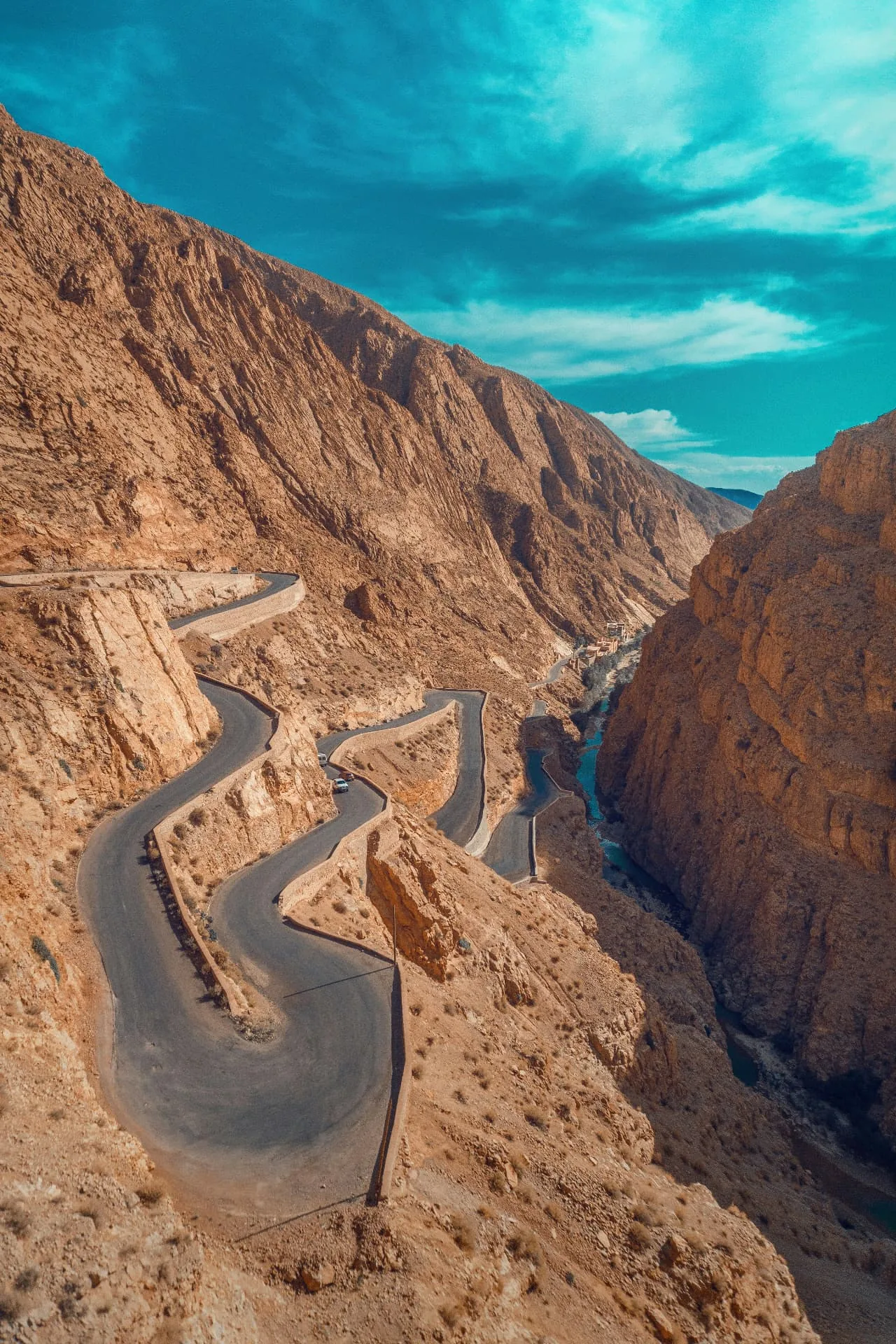 Tissadrine road winding through the ochre mountains of Dades Valley